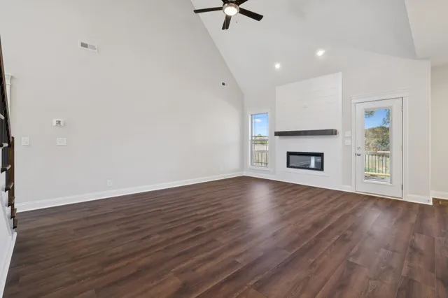 a kitchen with kitchen island white cabinets and refrigerator