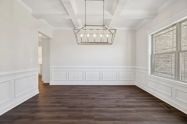 an empty room with a empty space and a ceiling fan