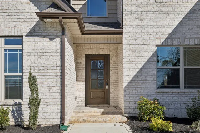 a living room with a fireplace and a window