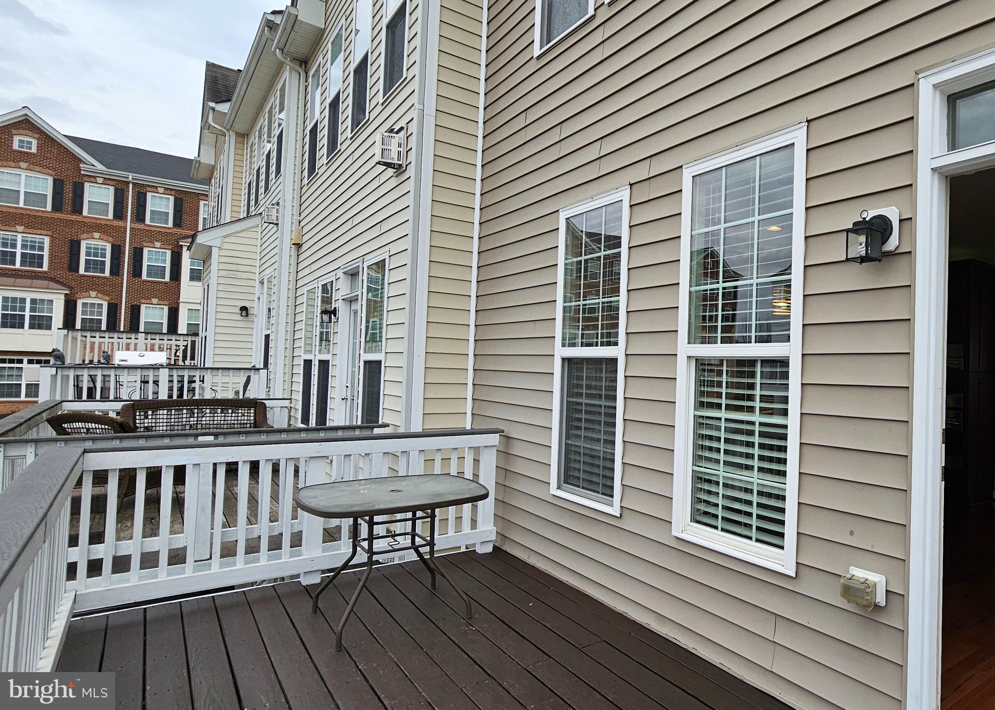 22629 Hawkbill Square Brambleton, VA 20148 - Photo 18 of 40 a view of a brick building from a balcony