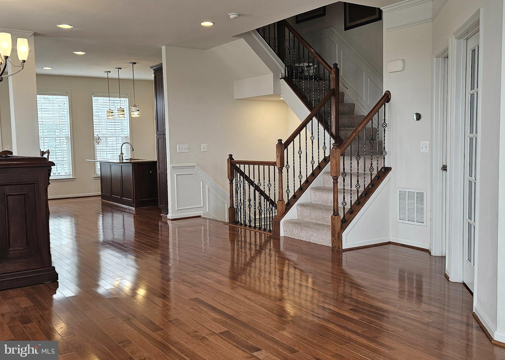 22629 Hawkbill Square Brambleton, VA 20148 - Photo 20 of 40 a view of entryway and hall with wooden floor