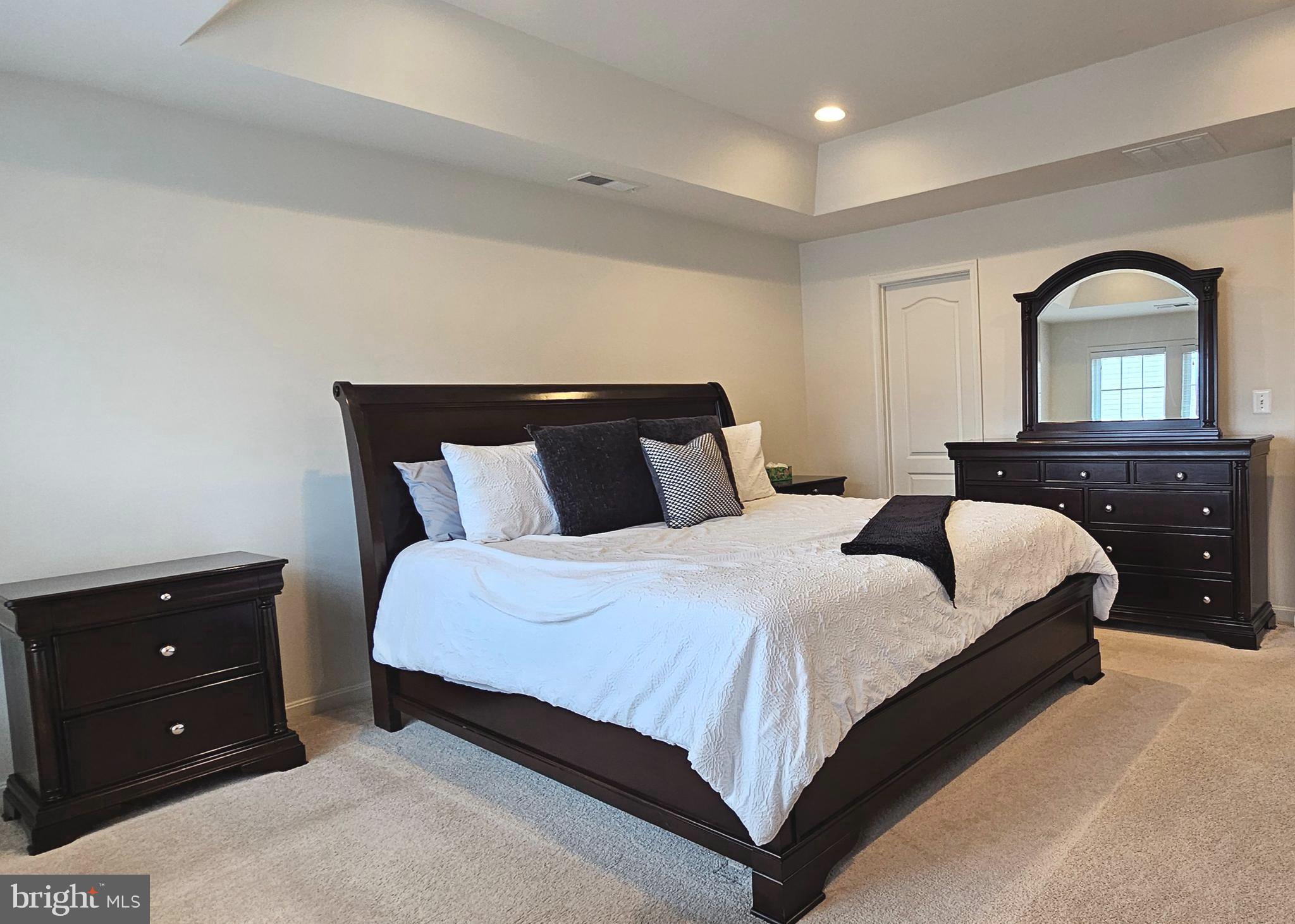 22629 Hawkbill Square Brambleton, VA 20148 - Photo 24 of 40 a bedroom with a bed and a dresser