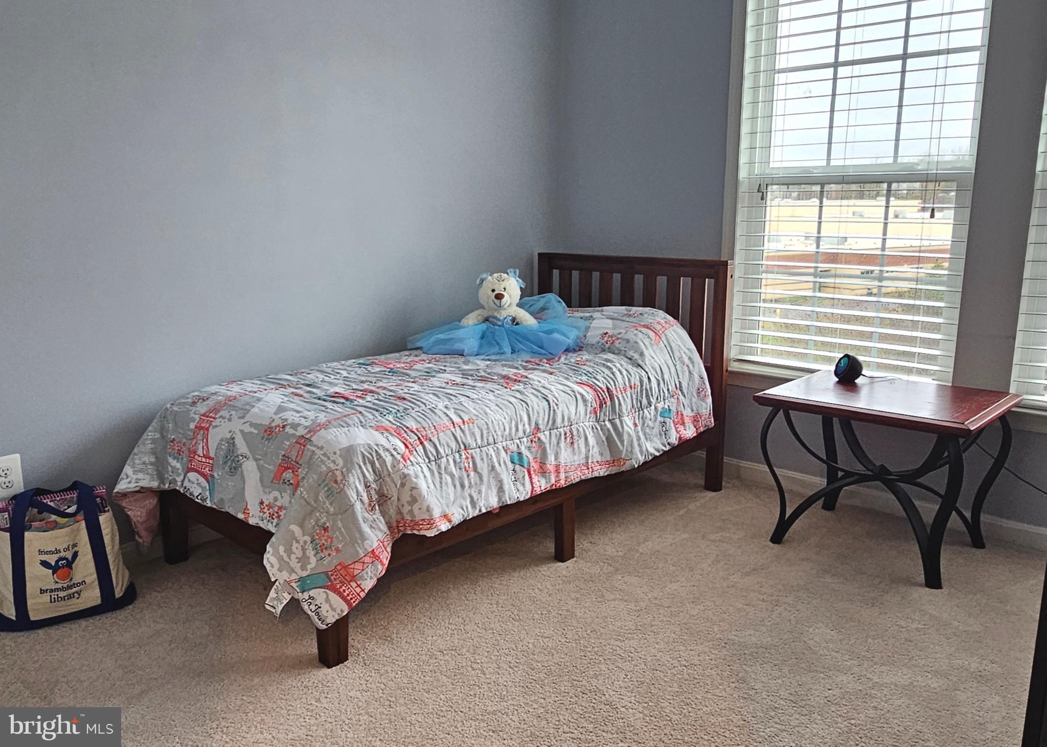 22629 Hawkbill Square Brambleton, VA 20148 - Photo 28 of 40 a bed sitting in a bedroom next to a window
