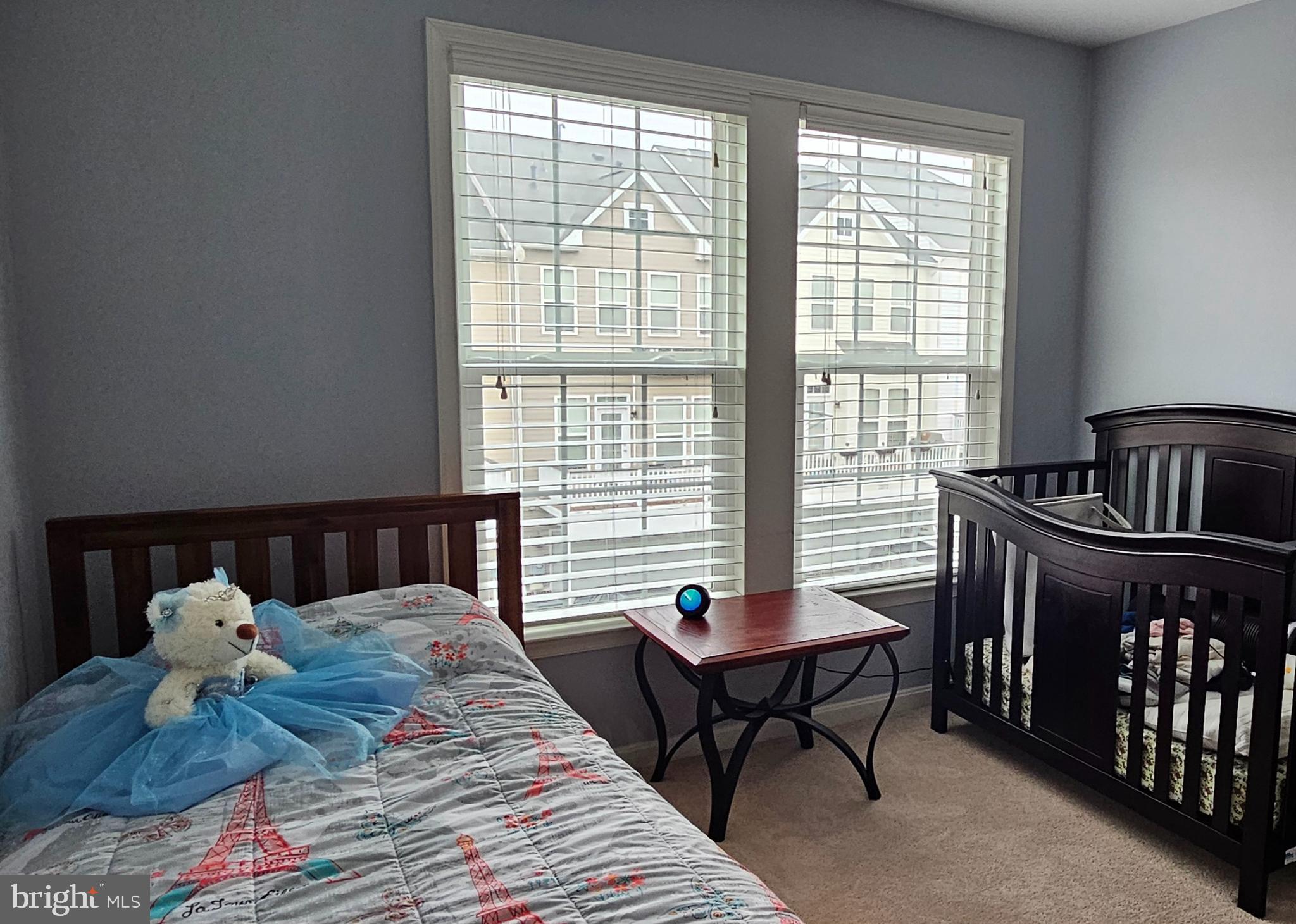 22629 Hawkbill Square Brambleton, VA 20148 - Photo 29 of 40 a bedroom with a bed and a window