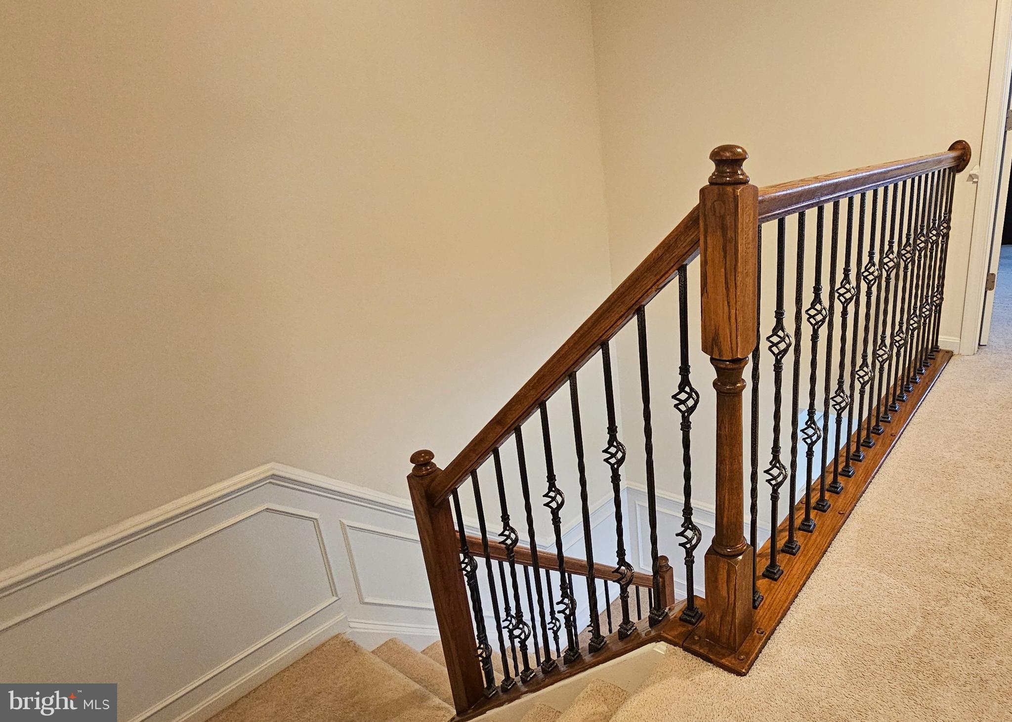 22629 Hawkbill Square Brambleton, VA 20148 - Photo 35 of 40 a view of staircase with railing and white walls