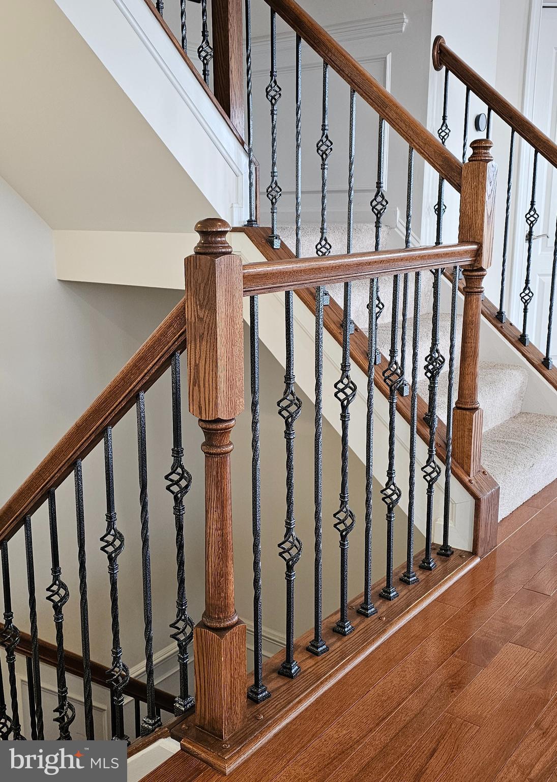 22629 Hawkbill Square Brambleton, VA 20148 - Photo 37 of 40 a view of an entryway with wooden floor and stairs