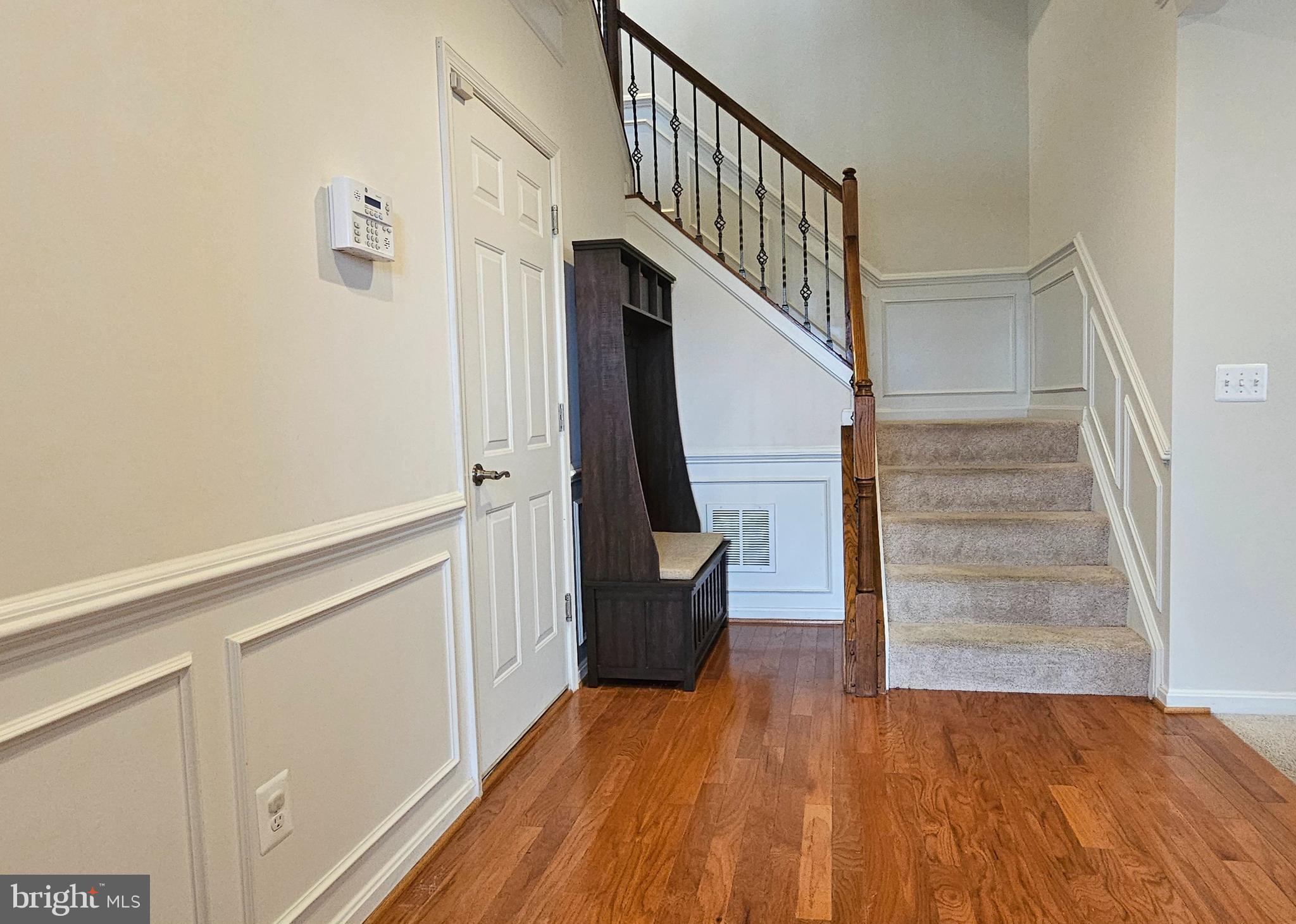 22629 Hawkbill Square Brambleton, VA 20148 - Photo 4 of 40 a view of entryway and hall with wooden floor