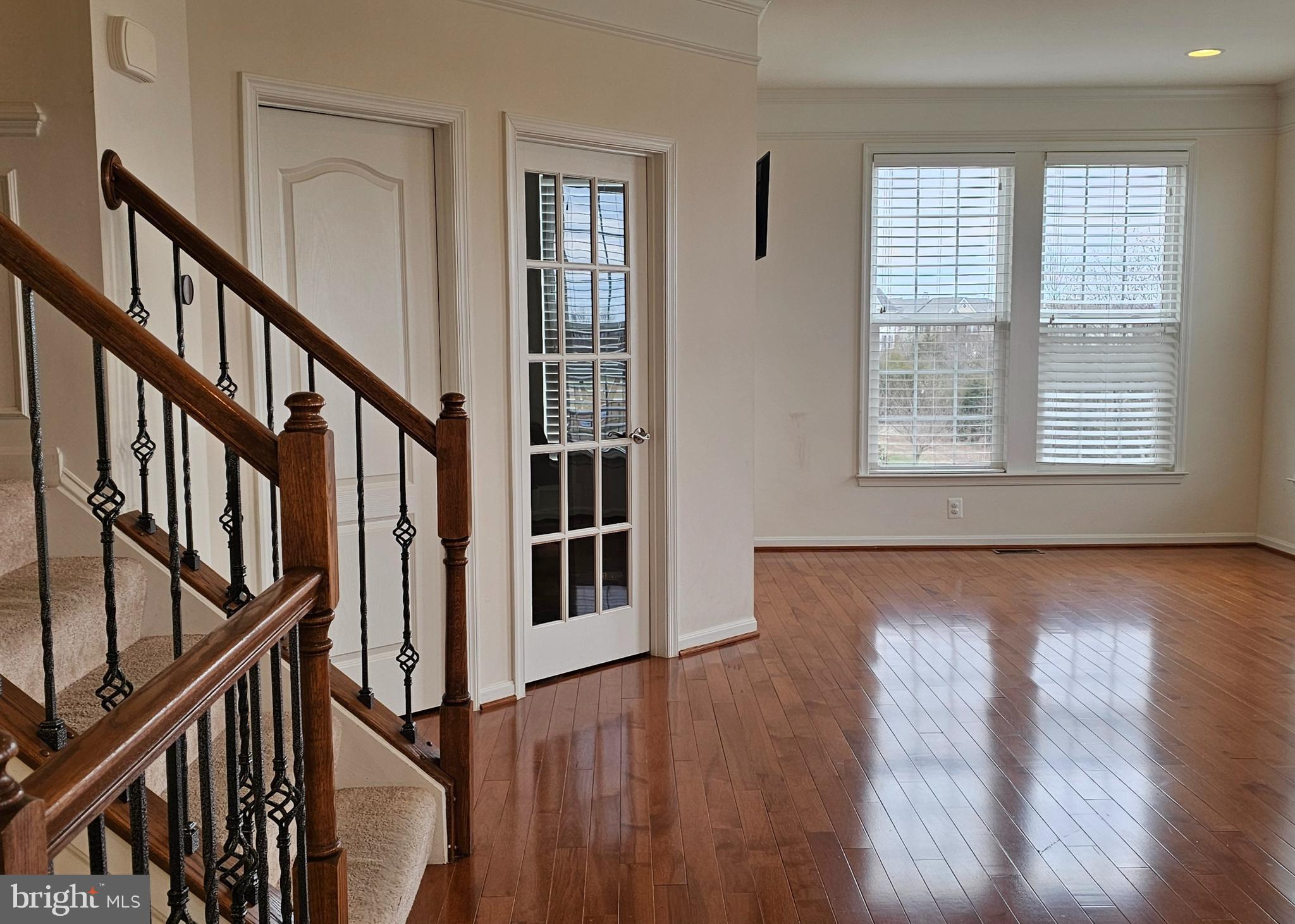 22629 Hawkbill Square Brambleton, VA 20148 - Photo 9 of 40 a view of an entryway with wooden floor and windows