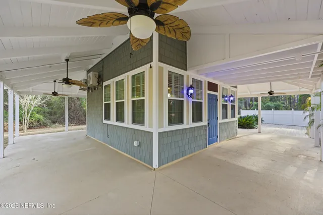 a view of an empty room with a windows