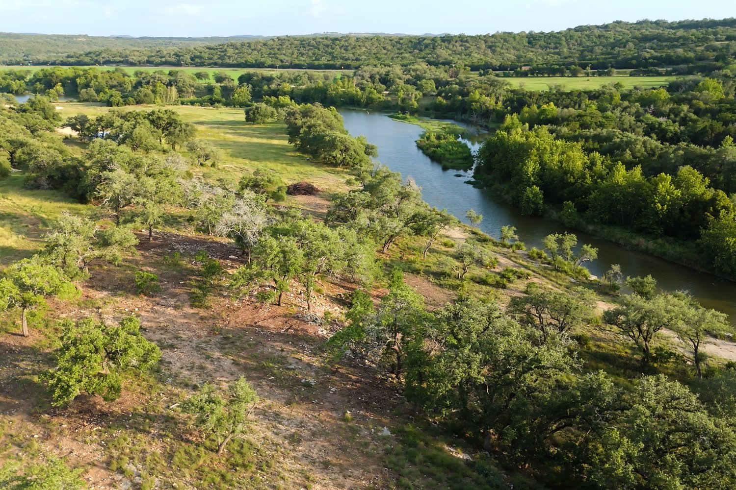 a view of lake with green space