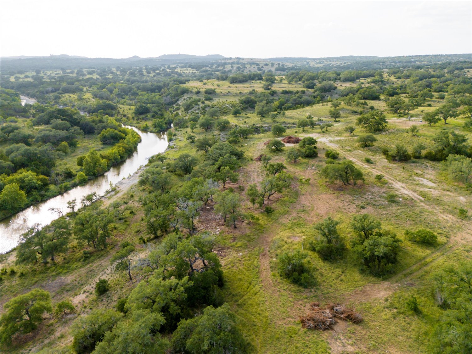 Lot 7 Byrd Ranch Road Johnson City, TX 78636 - Photo 13 of 25 a view of a lush green field