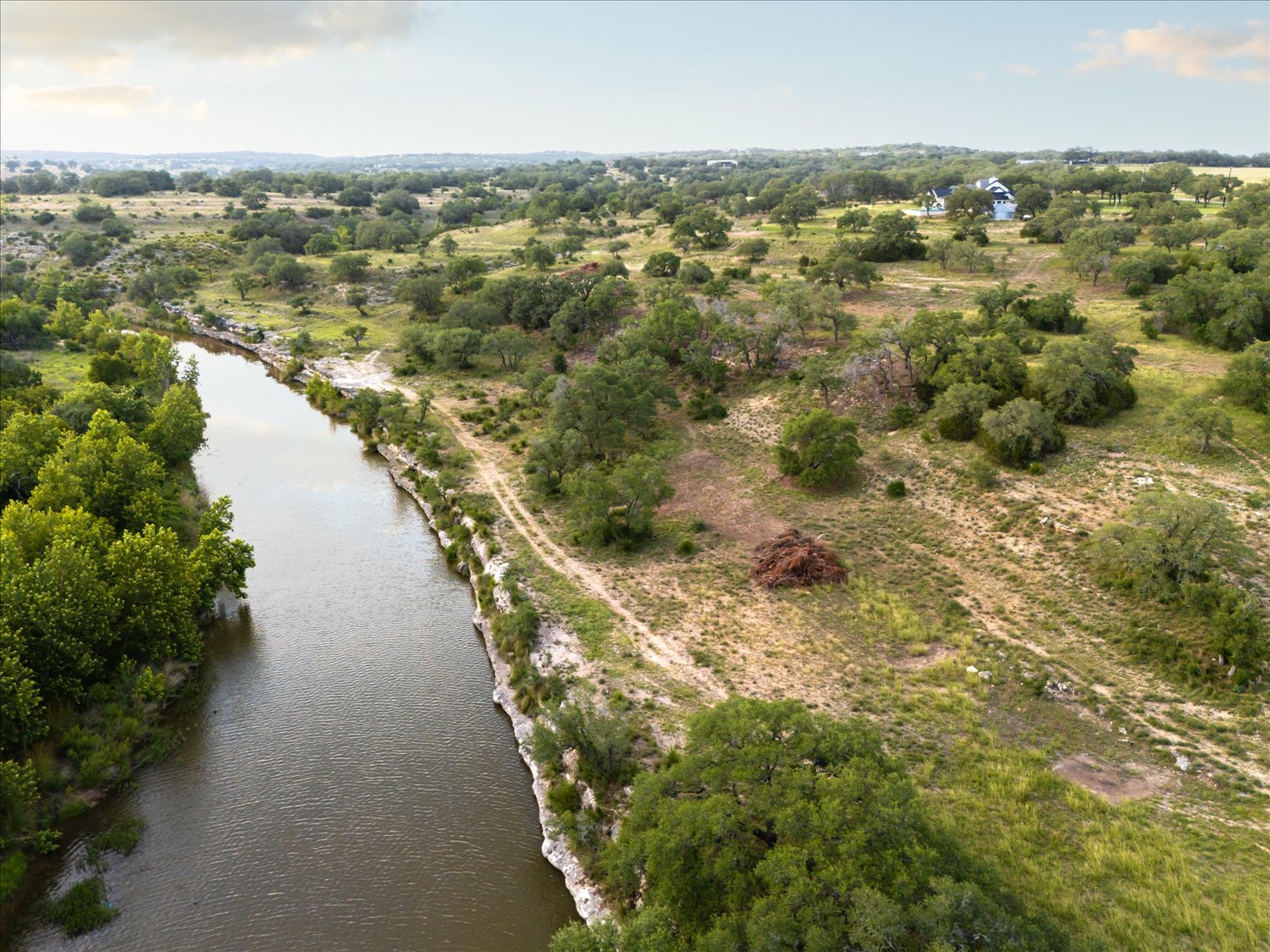 Lot 7 Byrd Ranch Road Johnson City, TX 78636 - Photo 14 of 25 a view of a lake with houses