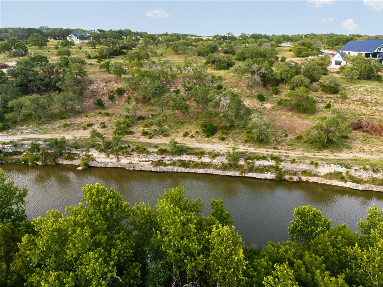 Lot 7 Byrd Ranch Road Johnson City, TX 78636 - Photo 16 of 25 an aerial view of residential houses with outdoor space and lake view