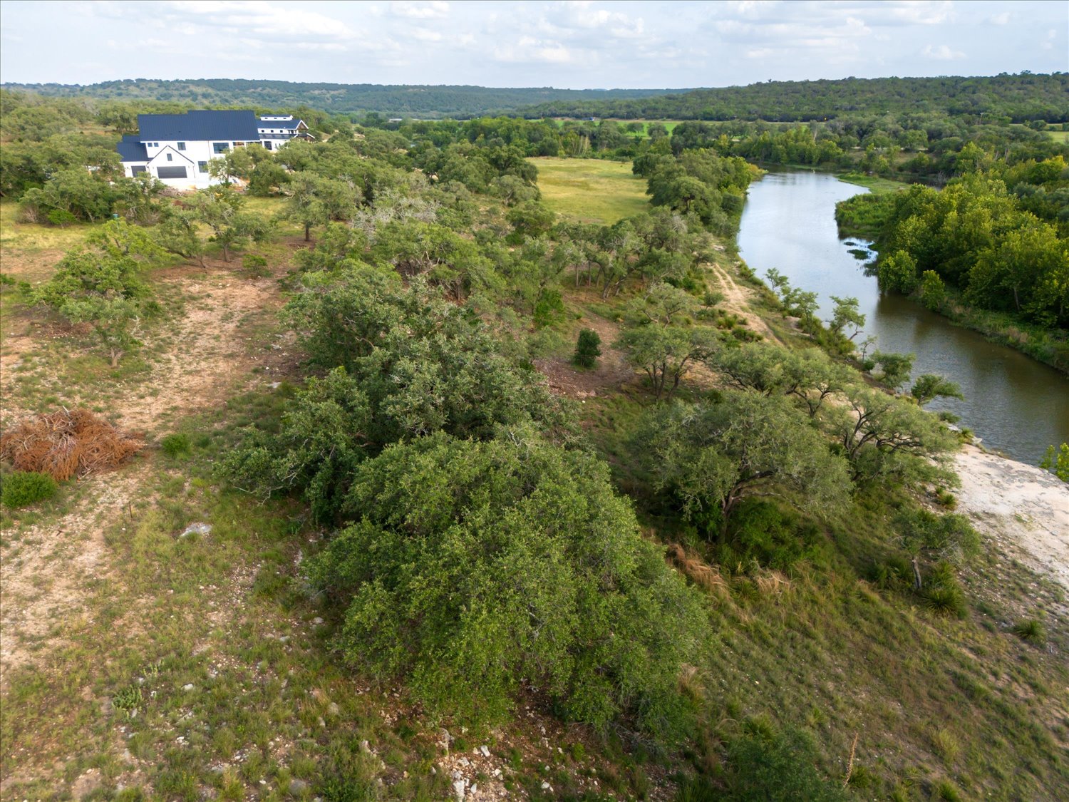 Lot 7 Byrd Ranch Road Johnson City, TX 78636 - Photo 24 of 25 a view of a lake with a city