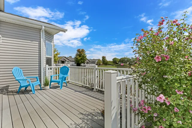 a view of a two chairs on the roof deck