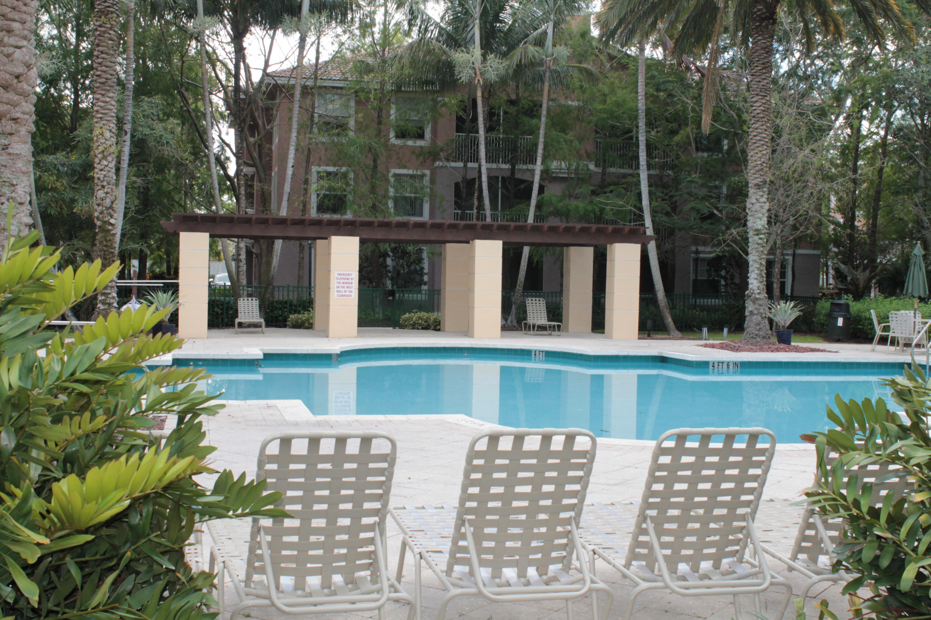 6682 West Sample Road, Unit 6682 Coral Springs, FL 33067 - Photo 2 of 9 a view of balcony with furniture