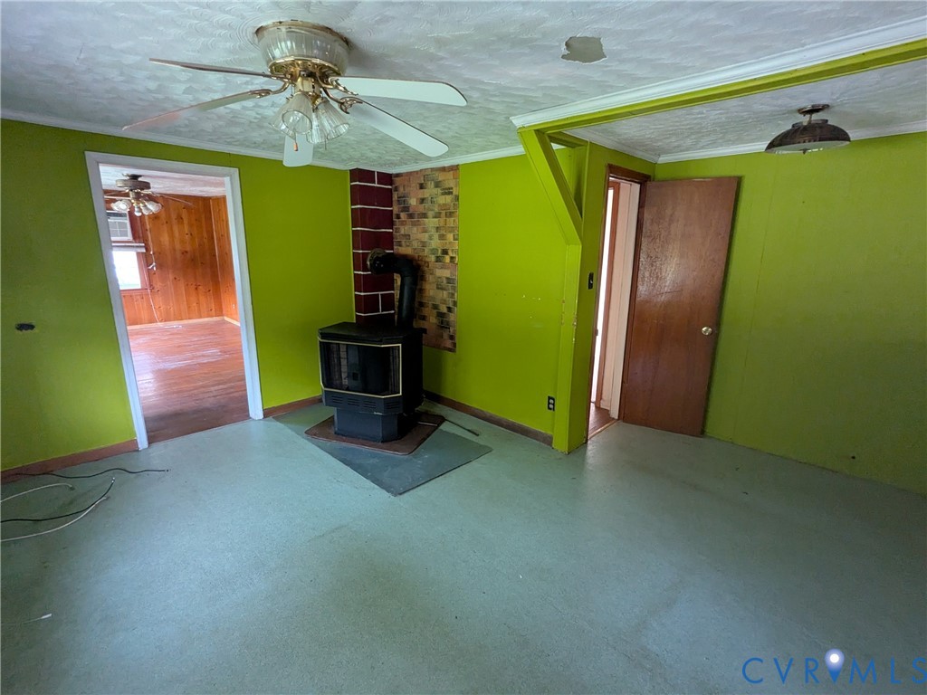 494 Reigel Road Emporia, VA 23847 - Photo 17 of 26 a view of empty room with a fan and a window