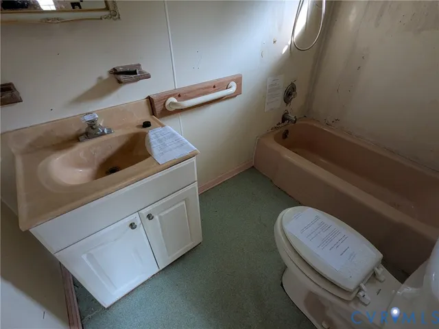 a bathroom with a toilet and a bathtub