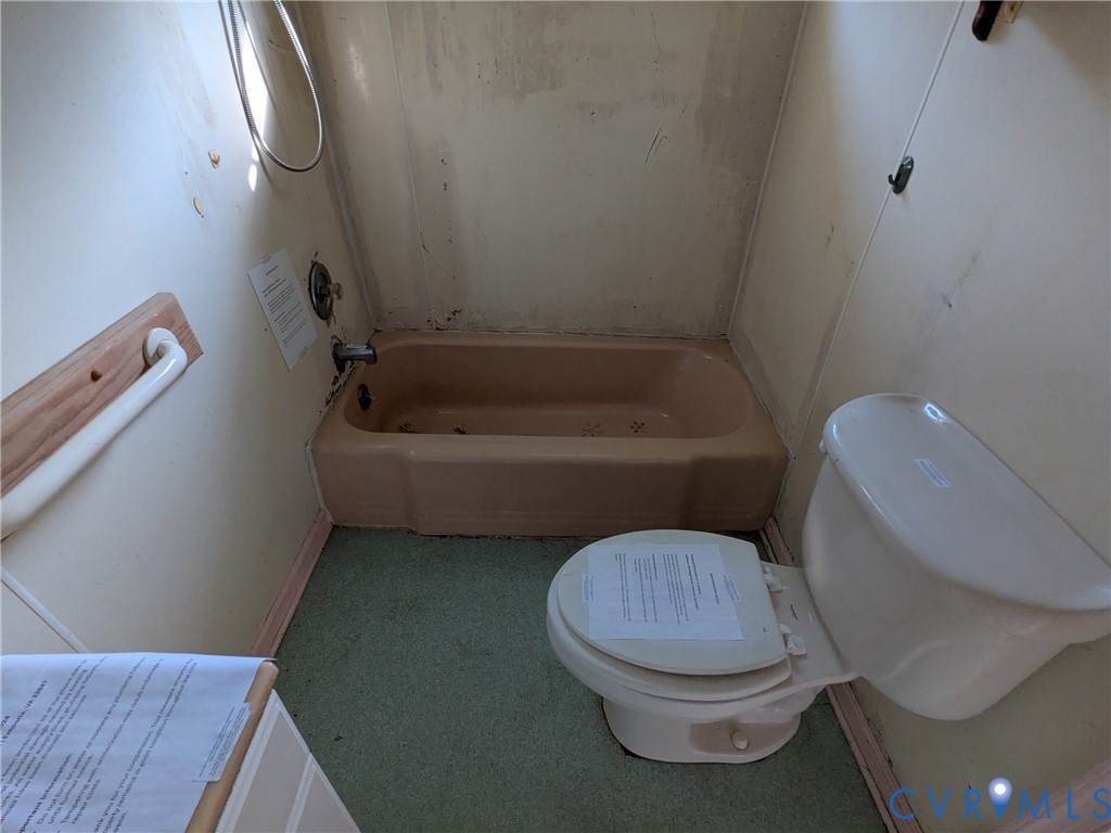 494 Reigel Road Emporia, VA 23847 - Photo 19 of 26 a bathroom with a toilet and a bathtub