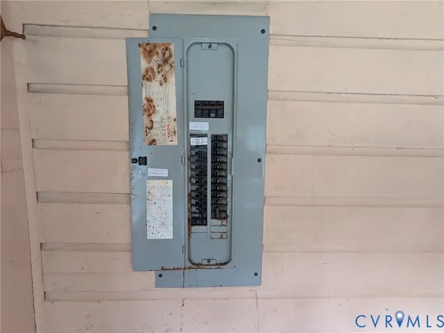 a view of a house with wooden fence