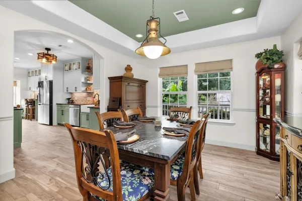 a kitchen with a stove a sink and a refrigerator