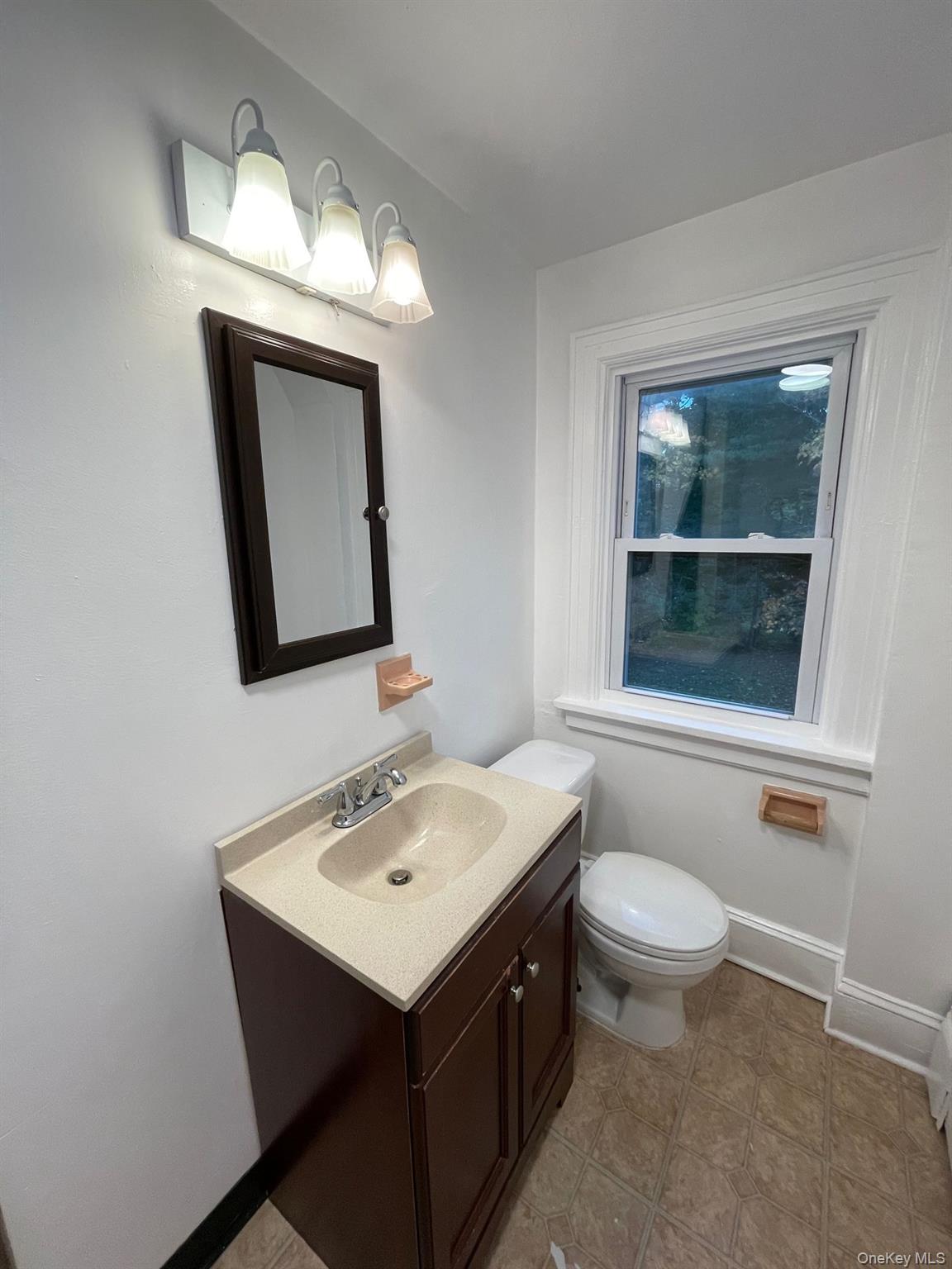 81 Kisor Road Highland, NY 12528 - Photo 16 of 17 a bathroom with a toilet sink and mirror