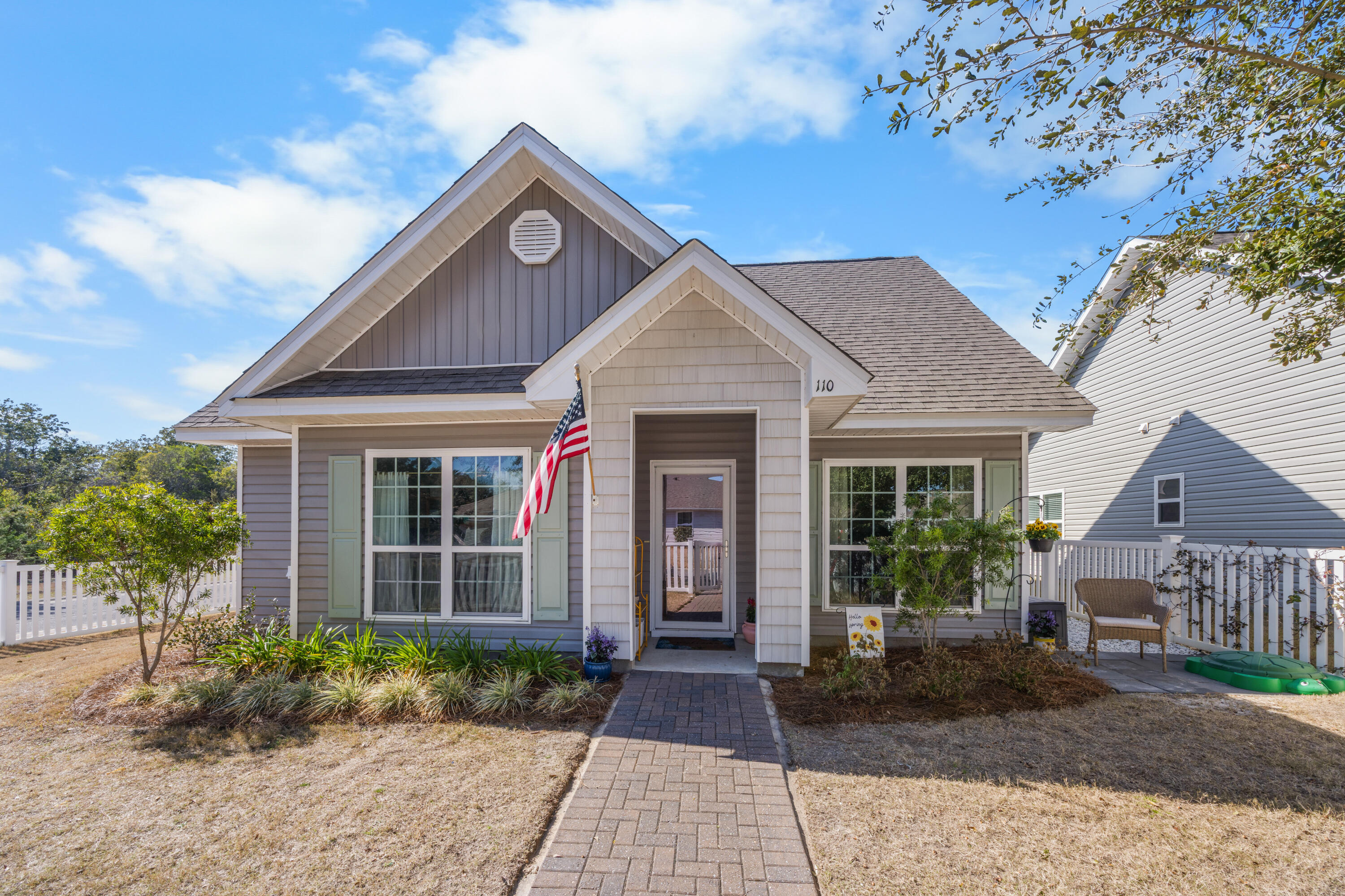 110 Cornelia Street Freeport, FL 32439 - Photo 2 of 60 a front view of a house with garden