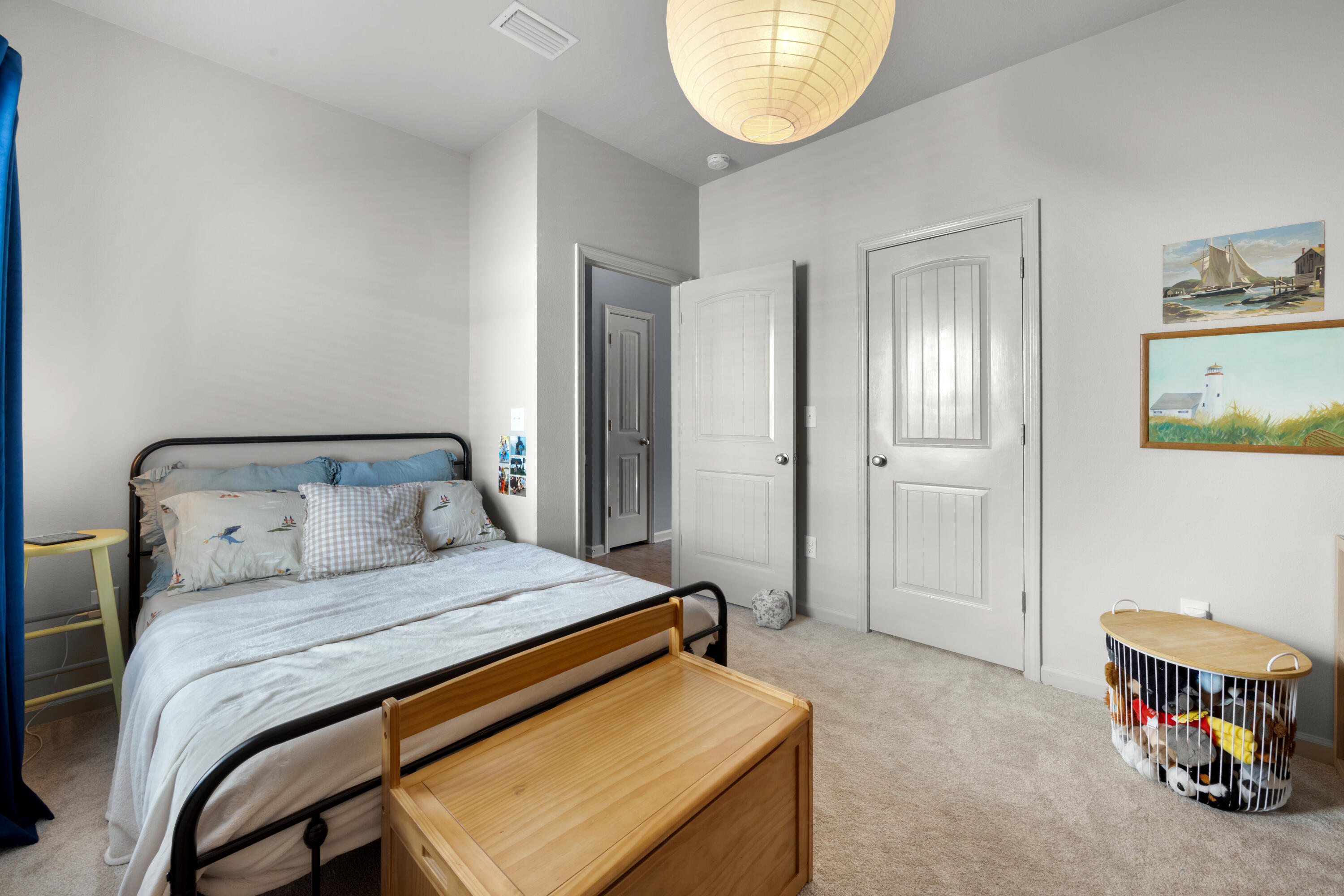 110 Cornelia Street Freeport, FL 32439 - Photo 26 of 60 a bedroom with a bed and a mirror