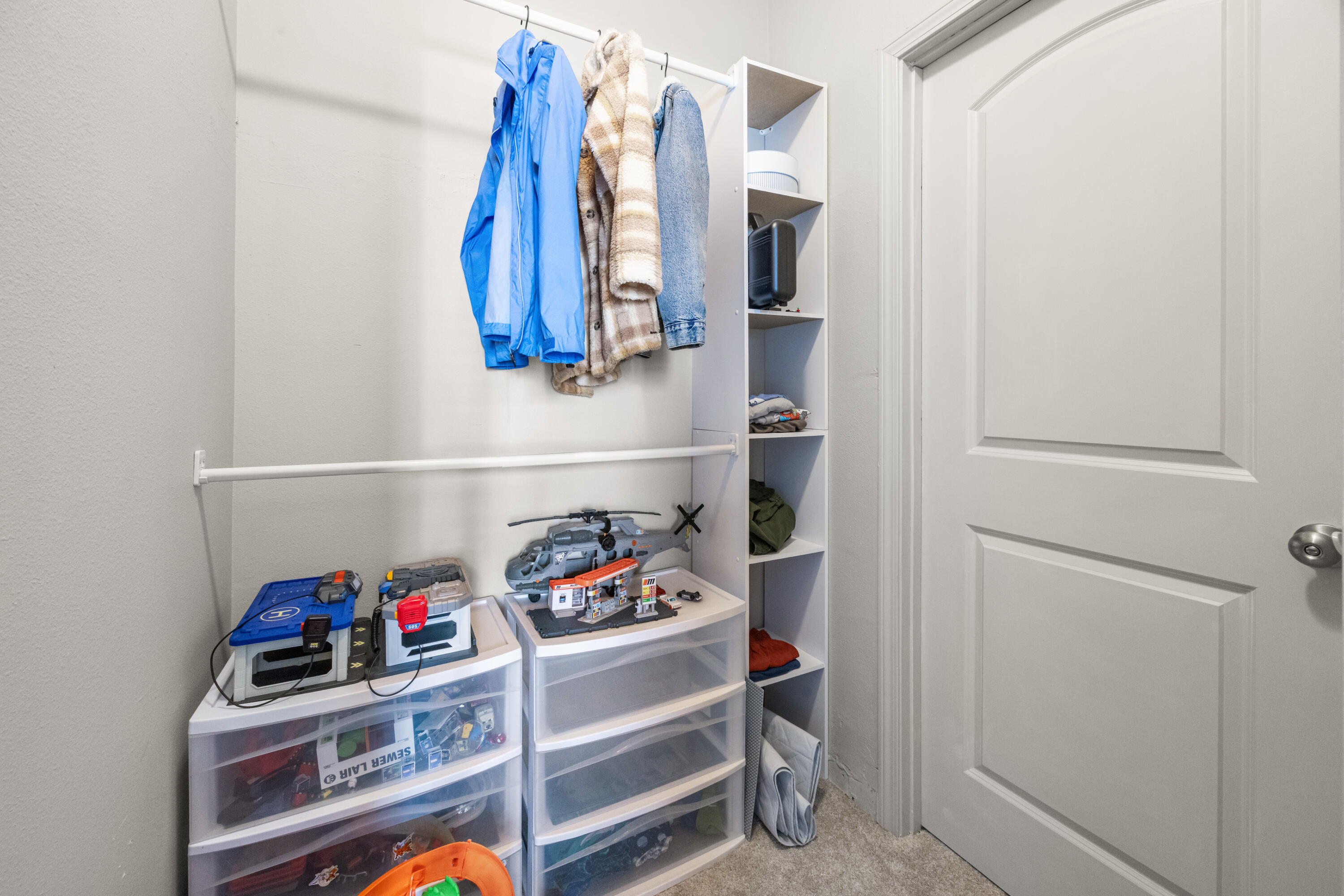 110 Cornelia Street Freeport, FL 32439 - Photo 27 of 60 a view of walk in closet with clothes and shoes