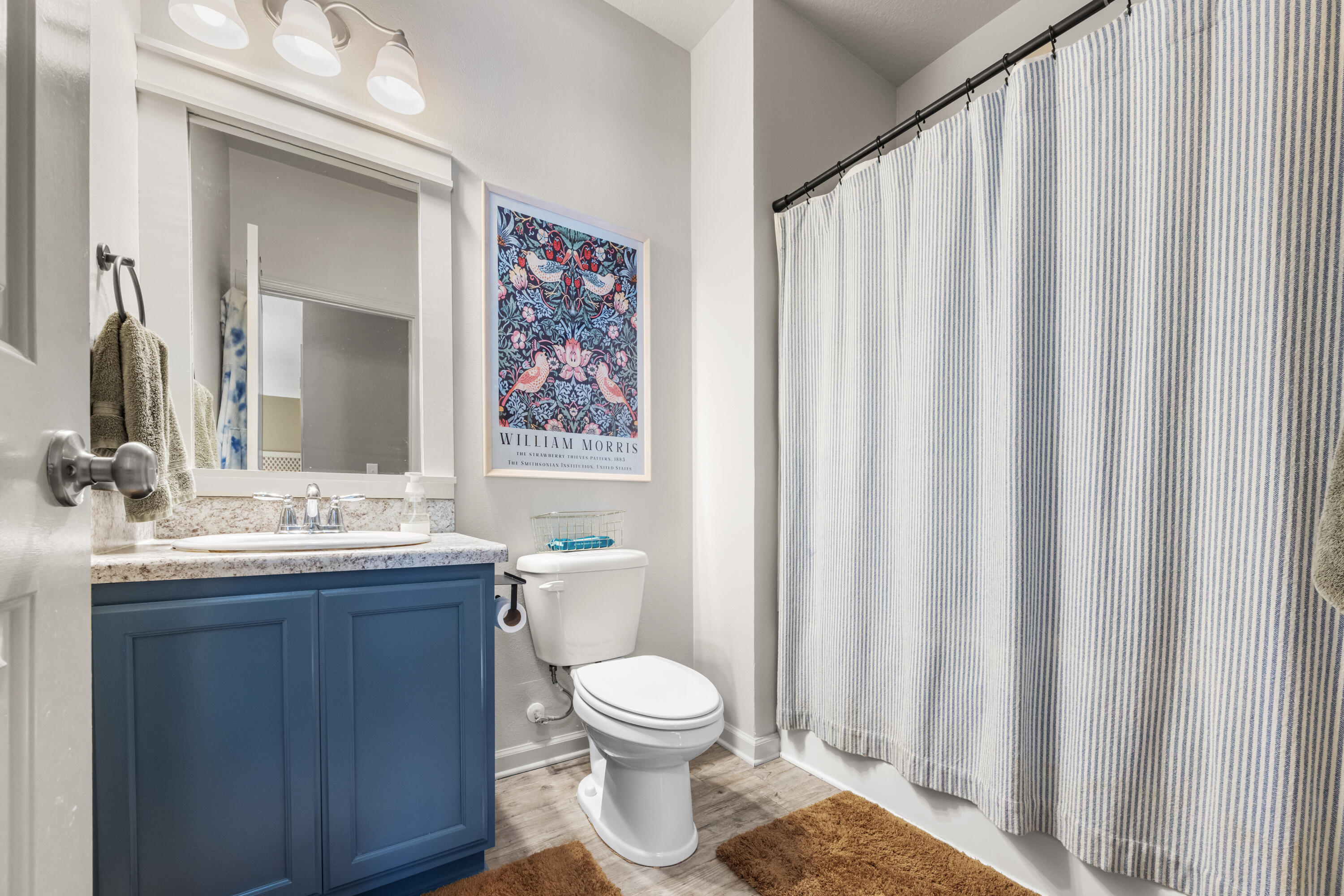 110 Cornelia Street Freeport, FL 32439 - Photo 28 of 60 a bathroom with a toilet sink and mirror
