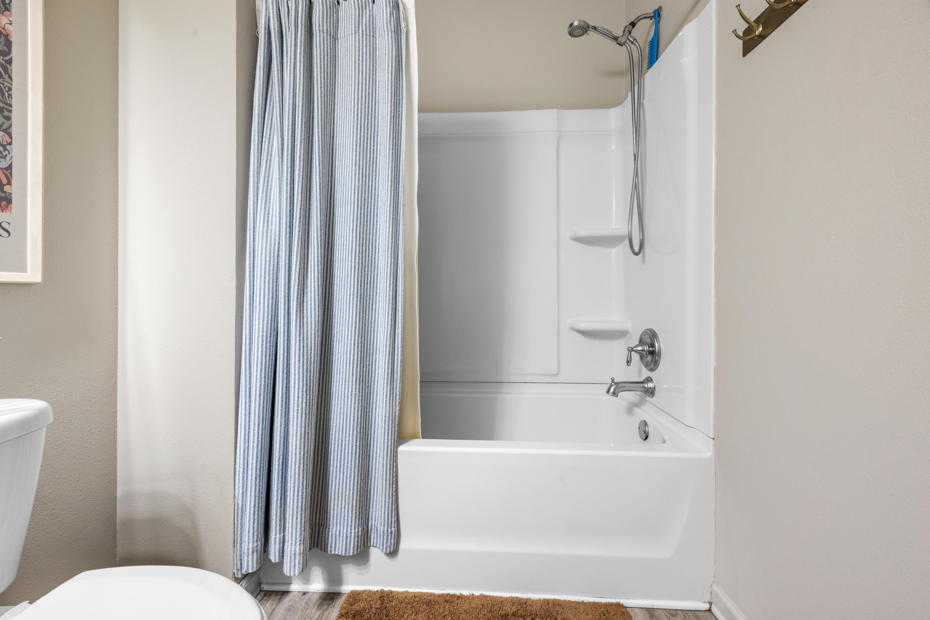 110 Cornelia Street Freeport, FL 32439 - Photo 30 of 60 a white bath tub sitting next to a white toilet