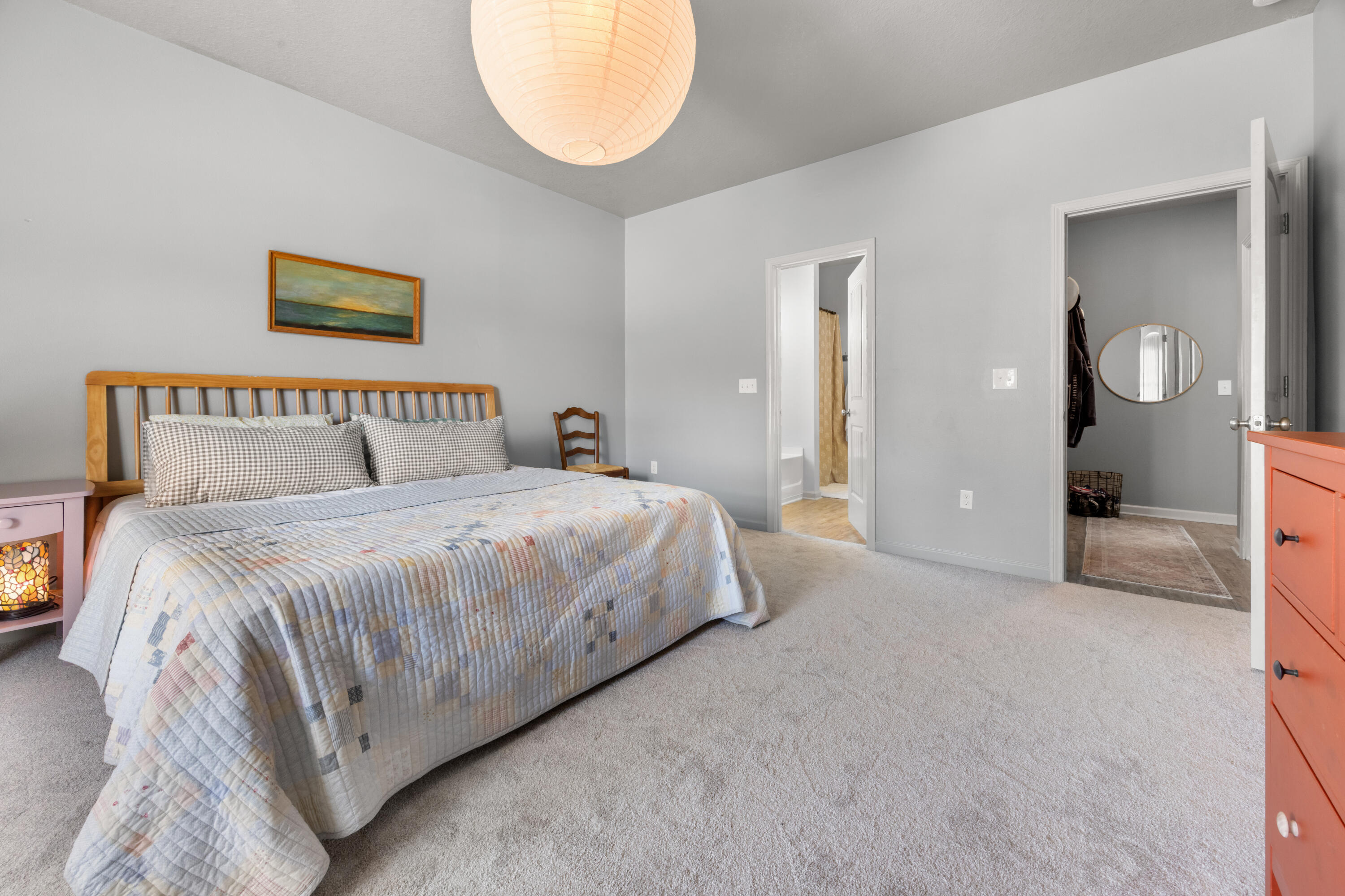 110 Cornelia Street Freeport, FL 32439 - Photo 37 of 60 a bedroom with a bed and a mirror