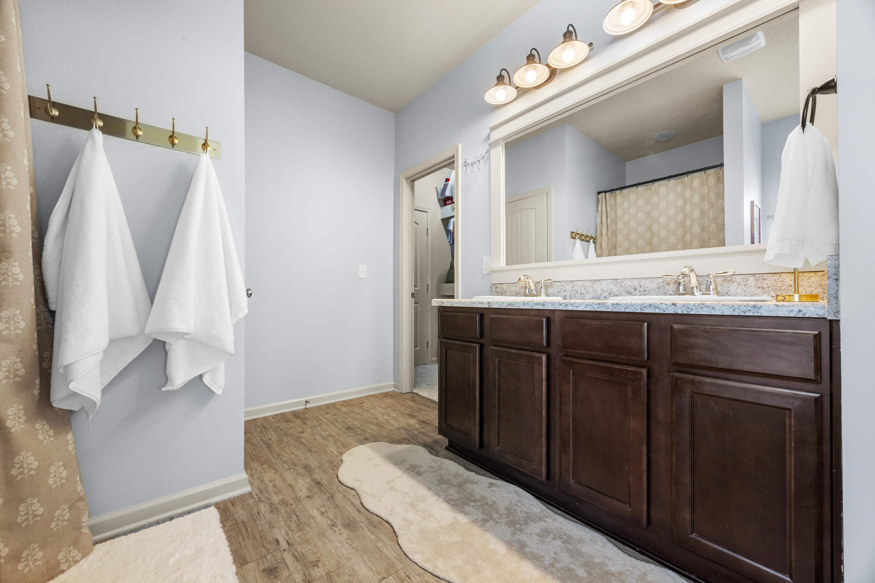 110 Cornelia Street Freeport, FL 32439 - Photo 39 of 60 a en suite bathroom with a granite countertop sink and a mirror
