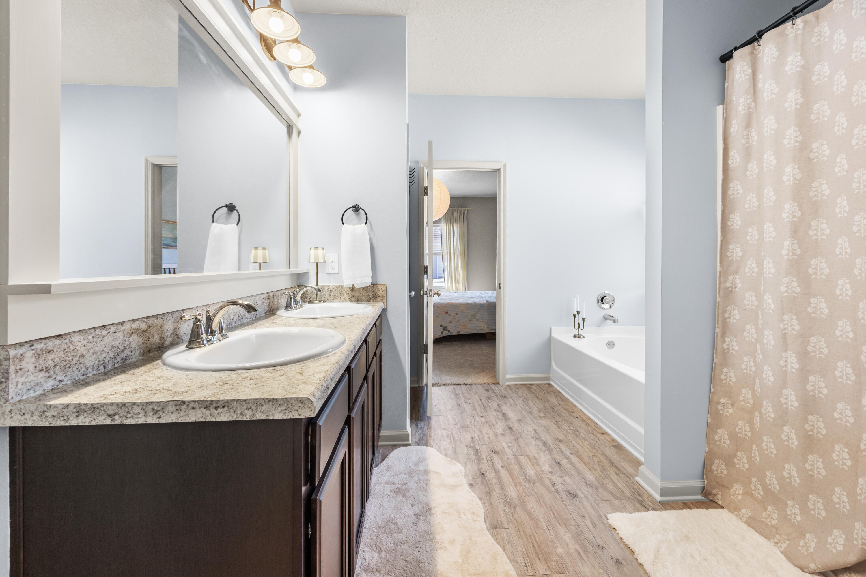 110 Cornelia Street Freeport, FL 32439 - Photo 40 of 60 a en suite bathroom with a granite countertop sink and a mirror