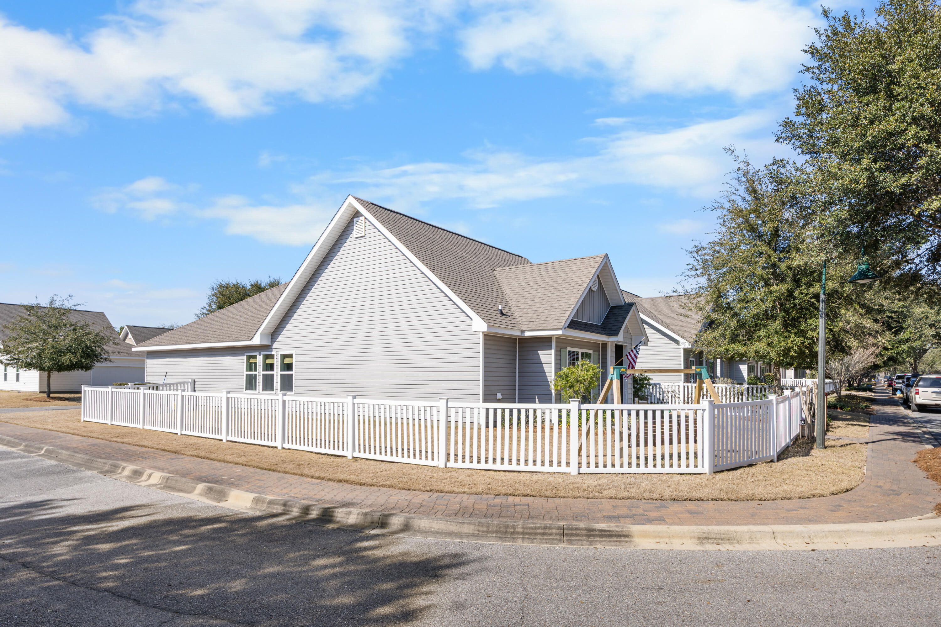 110 Cornelia Street Freeport, FL 32439 - Photo 4 of 60 a view of a house with a wooden fence