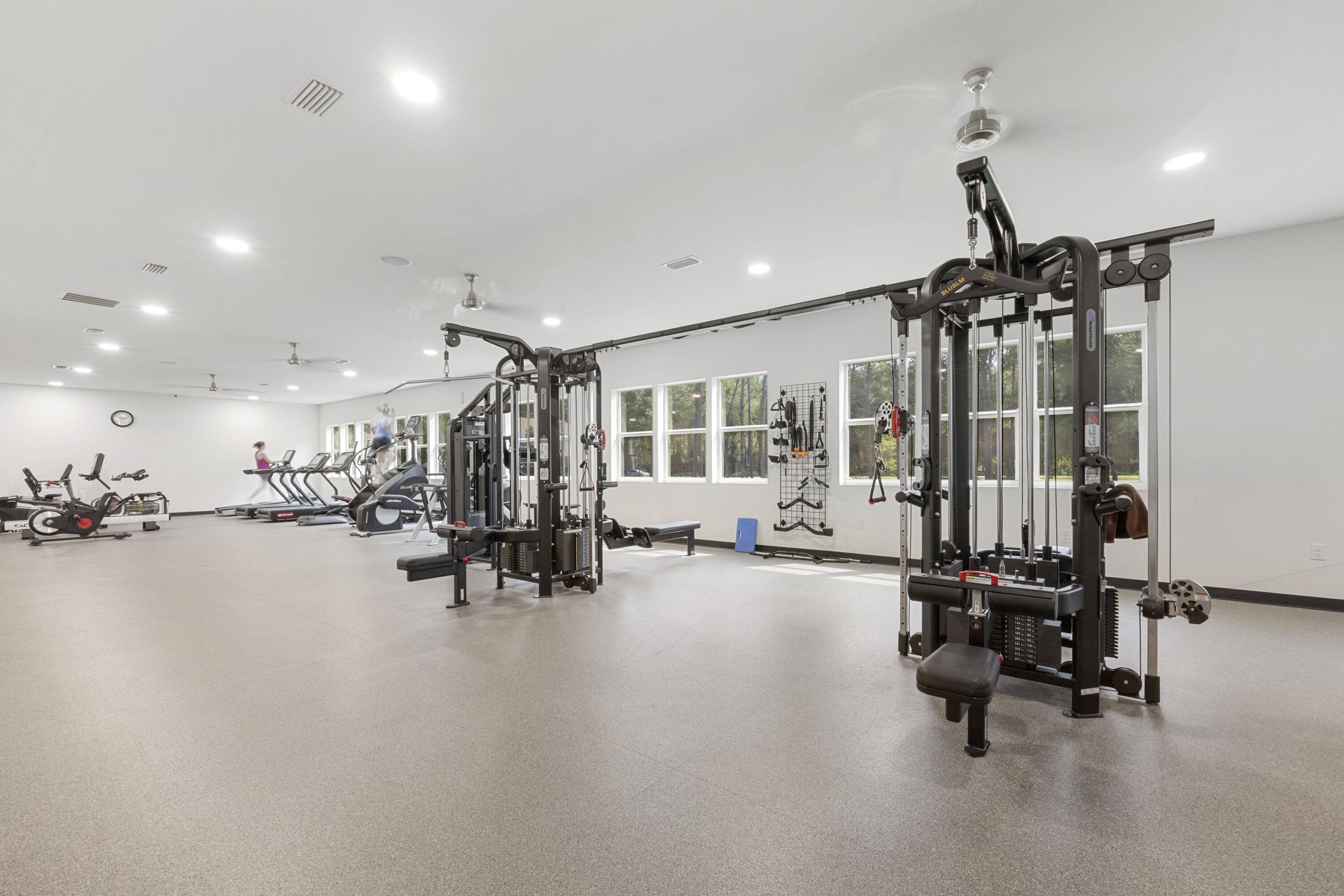 110 Cornelia Street Freeport, FL 32439 - Photo 47 of 60 a view of a room with gym equipment and a chandelier