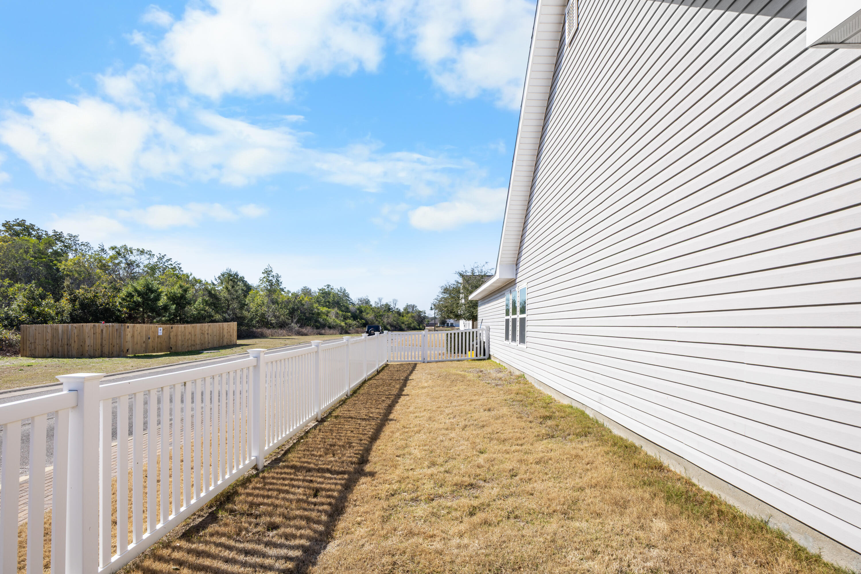110 Cornelia Street Freeport, FL 32439 - Photo 8 of 60 a view of a balcony next to a yard