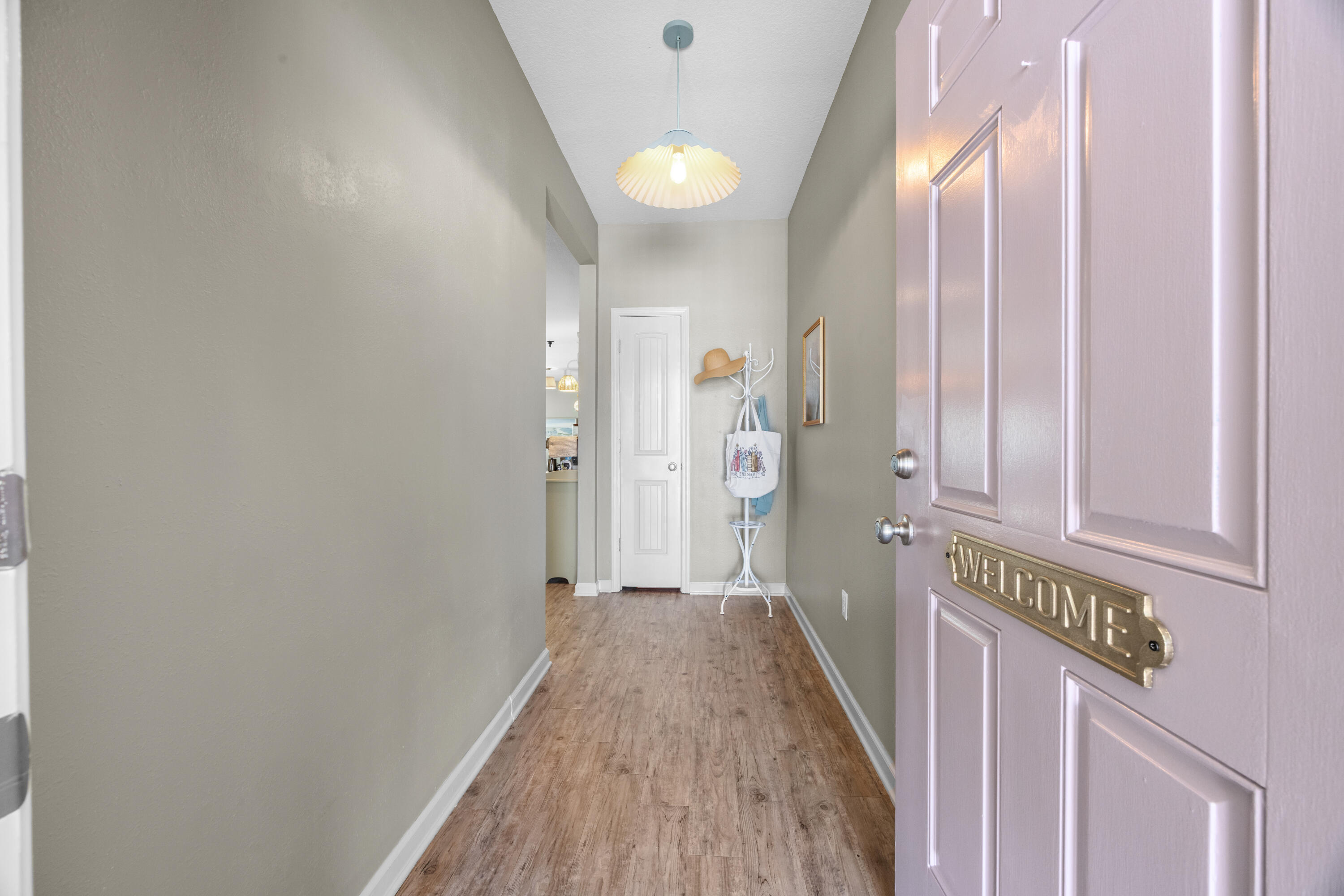 110 Cornelia Street Freeport, FL 32439 - Photo 9 of 60 a view of a hallway with wooden floor and staircase