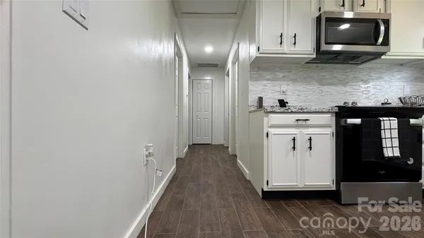 a view of a kitchen from the hallway