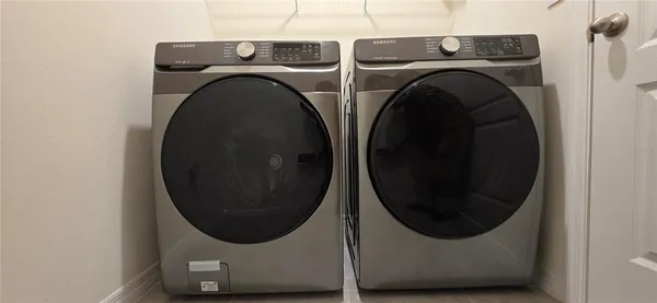 a utility room with dryer and washer