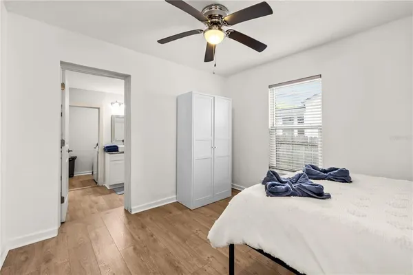 a bed room with a bed and a chandelier