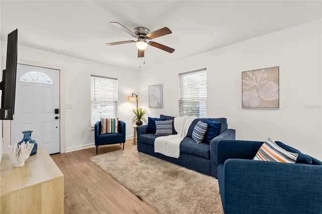 a living room with furniture and a flat screen tv