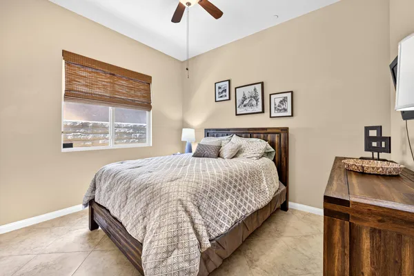 a bedroom with bed and a window