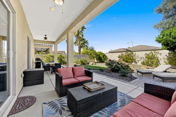 a outdoor living space with furniture and a potted plant