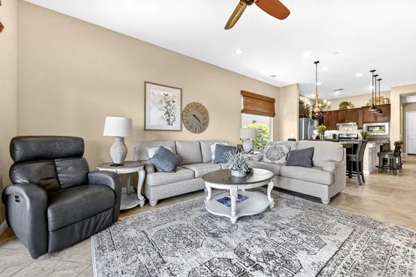a living room with furniture and a rug