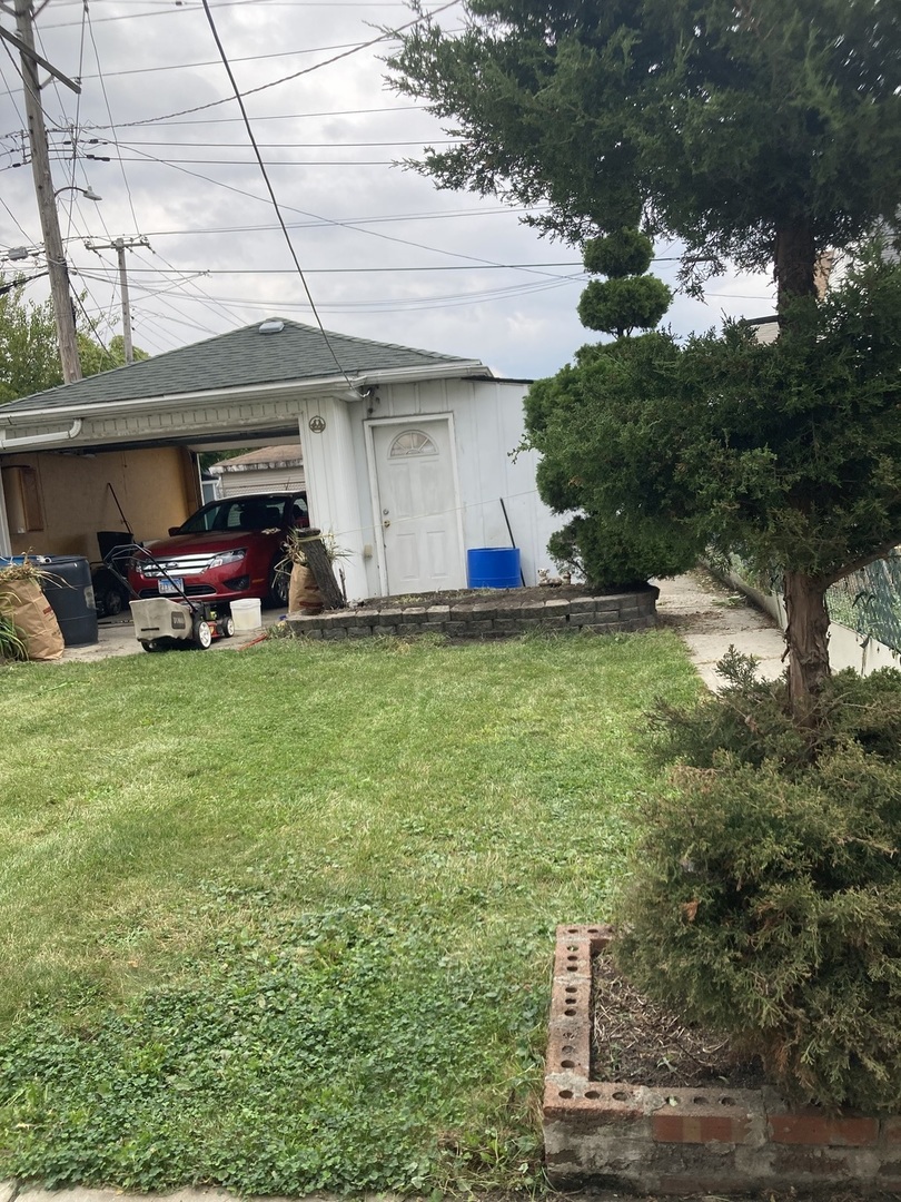 2239 South Central Avenue Cicero, IL 60804 - Photo 3 of 10 a view of a house with a yard and sitting area