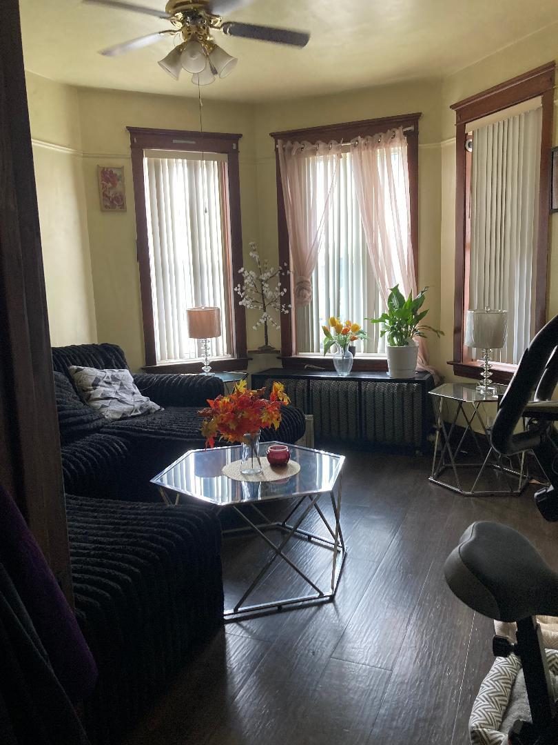 2239 South Central Avenue Cicero, IL 60804 - Photo 7 of 10 a living room with furniture and a large window
