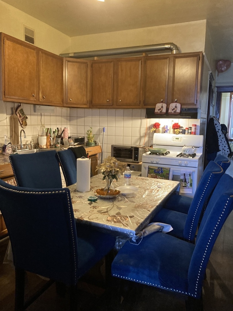 2239 South Central Avenue Cicero, IL 60804 - Photo 8 of 10 a kitchen with a sink and cabinets