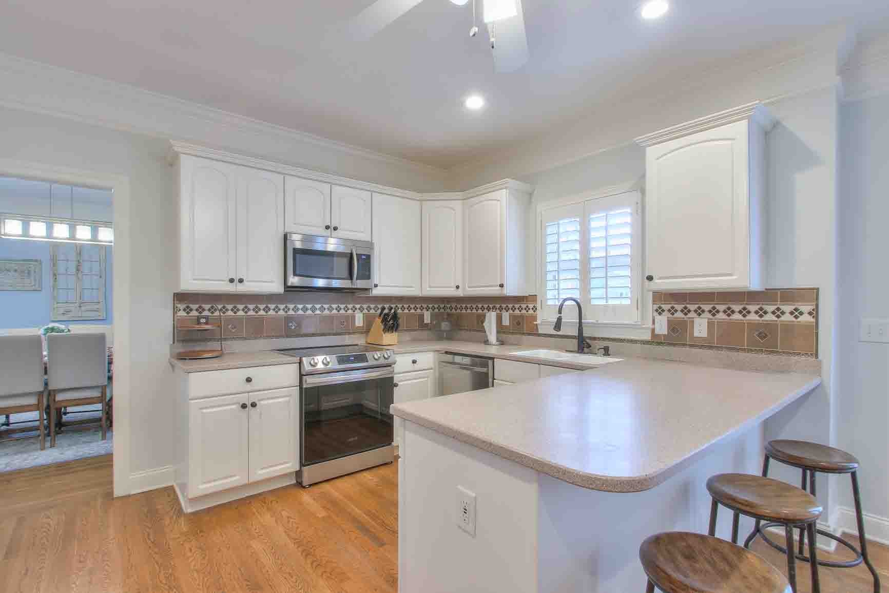 206 Polk Pl Drive Franklin, TN 37064 - Photo 13 of 47 a kitchen with a sink stainless steel appliances and cabinets