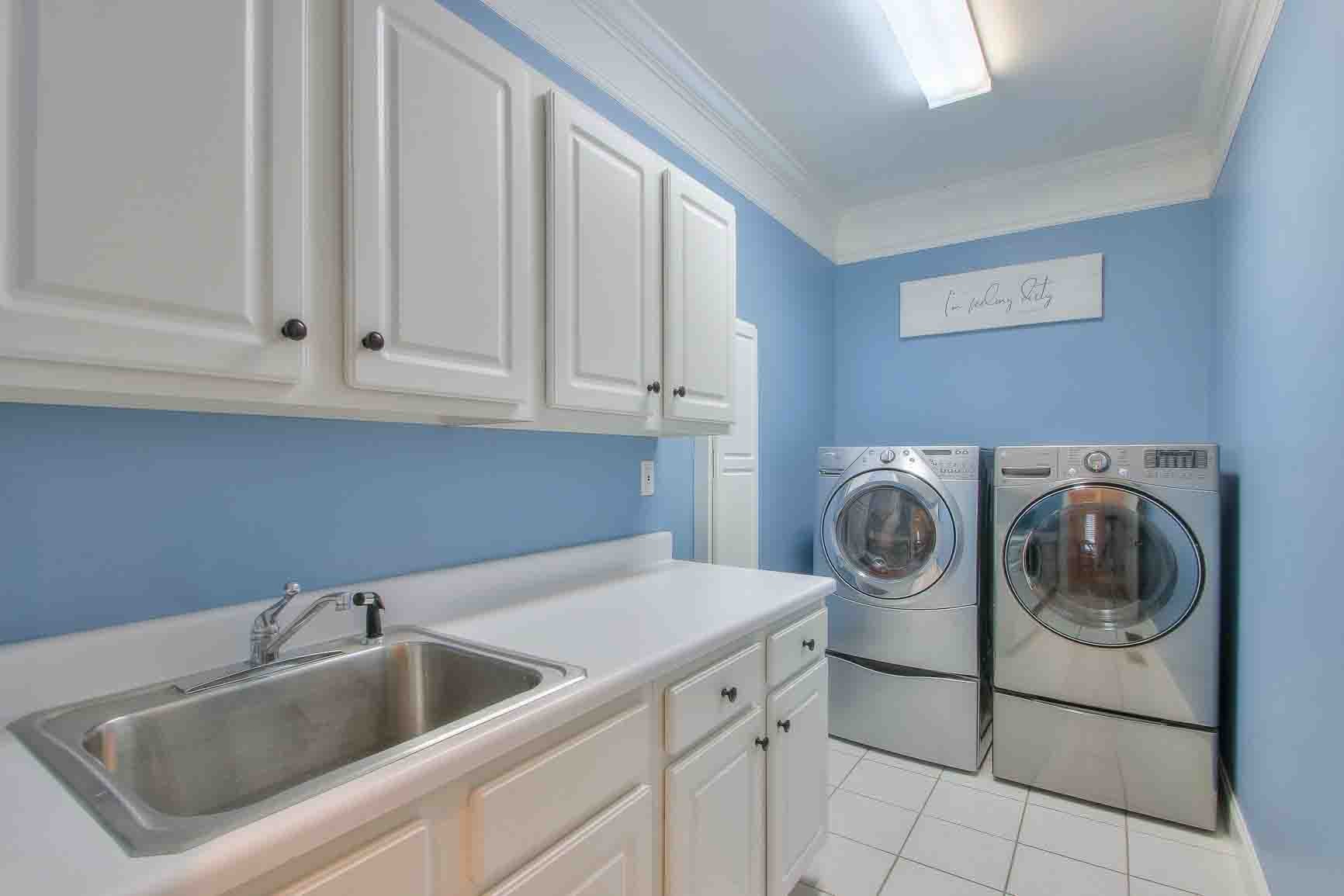 206 Polk Pl Drive Franklin, TN 37064 - Photo 18 of 47 a utility room with sink dryer and washer